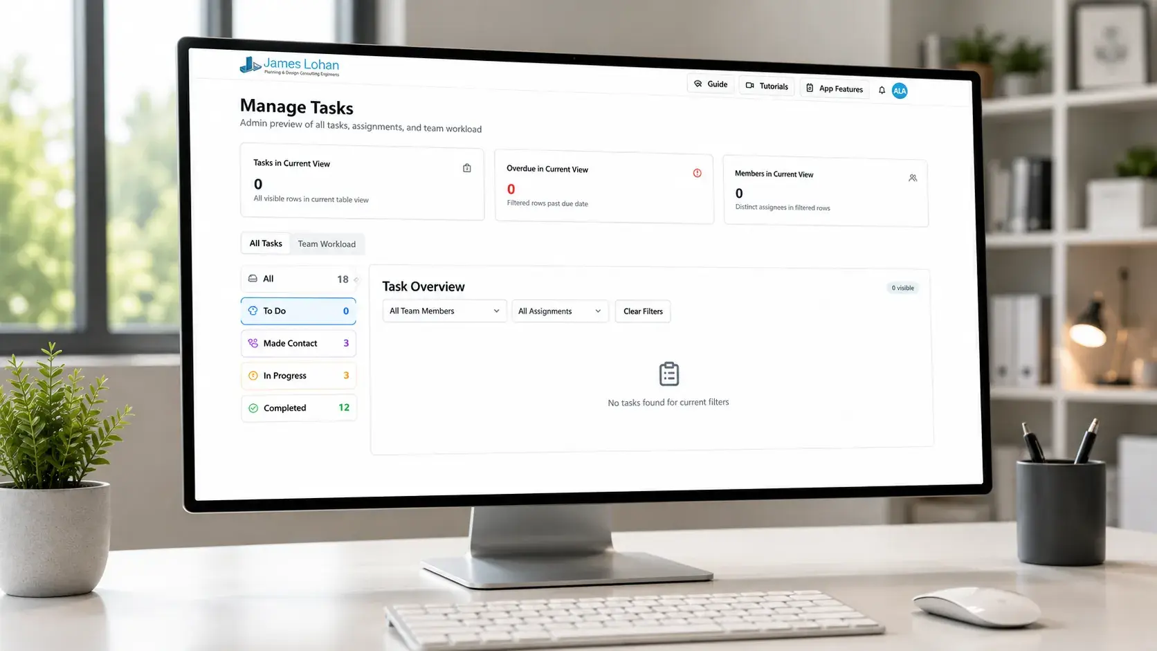 Manage Tasks admin view on a desktop monitor, with task status columns and team workload filters